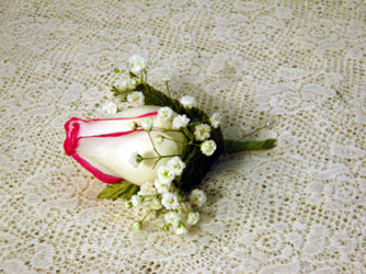 White and red boutonniere