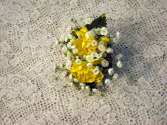 Yellow and white mini carnations boutonniere from Kircher's Flowers in Defiance and Paulding, OH