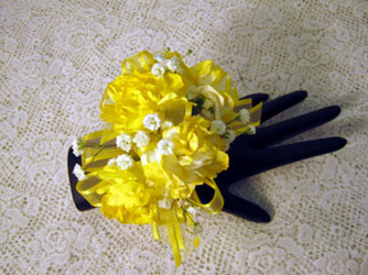 Yellow and white mini carnations corsage from Kircher's Flowers in Defiance and Paulding, OH